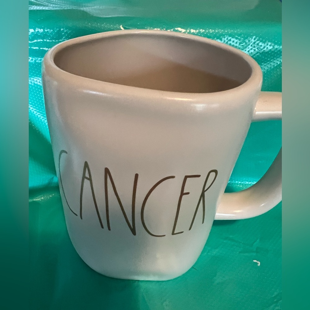 Rae Dunn white ceramic‎ mug with “CANCER” in black letters and gold stars